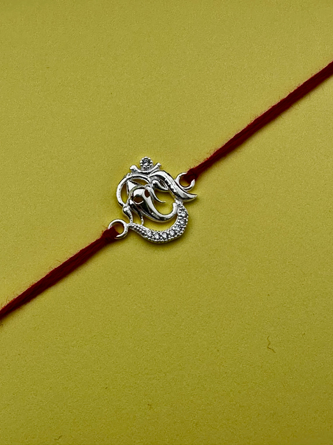 925 Sterling Silver Ganesh Rakhi with silver coin, chocolate and roli chawal plate