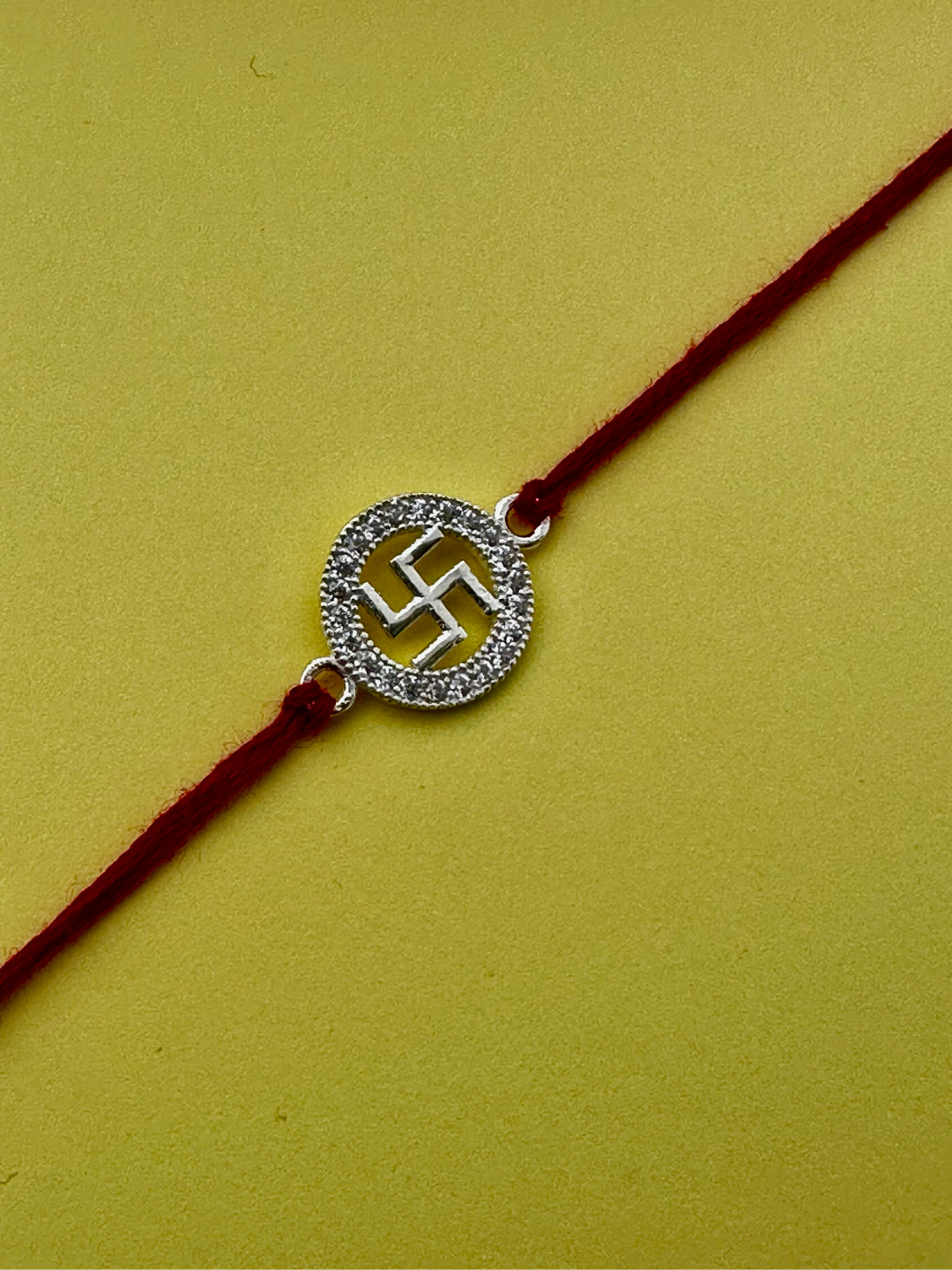 925 Sterling Silver Swastik Rakhi with silver coin, chocolate and roli chawal plate