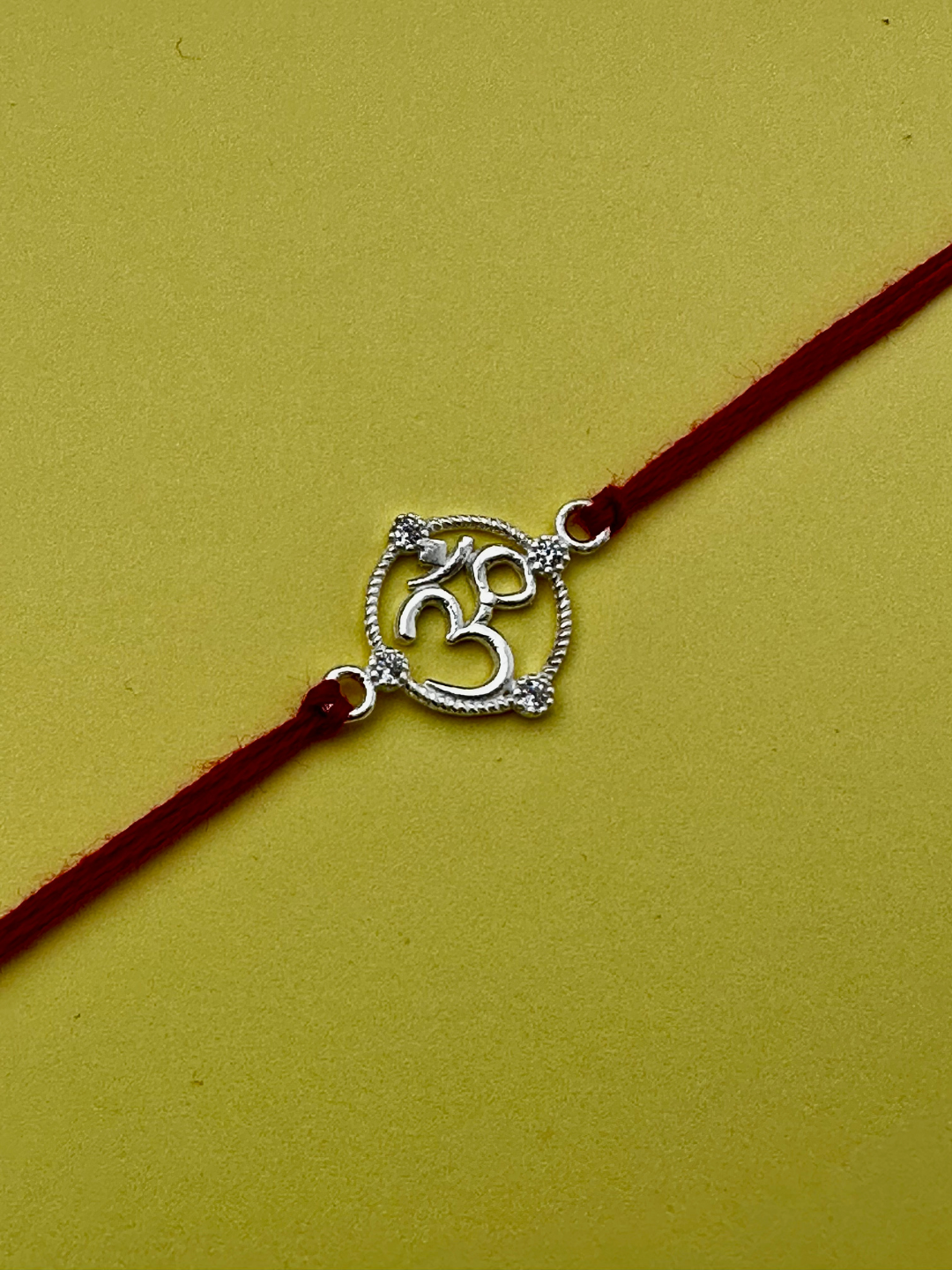 925 Sterling Silver Om Rakhi with silver coin, chocolate and roli chawal plate